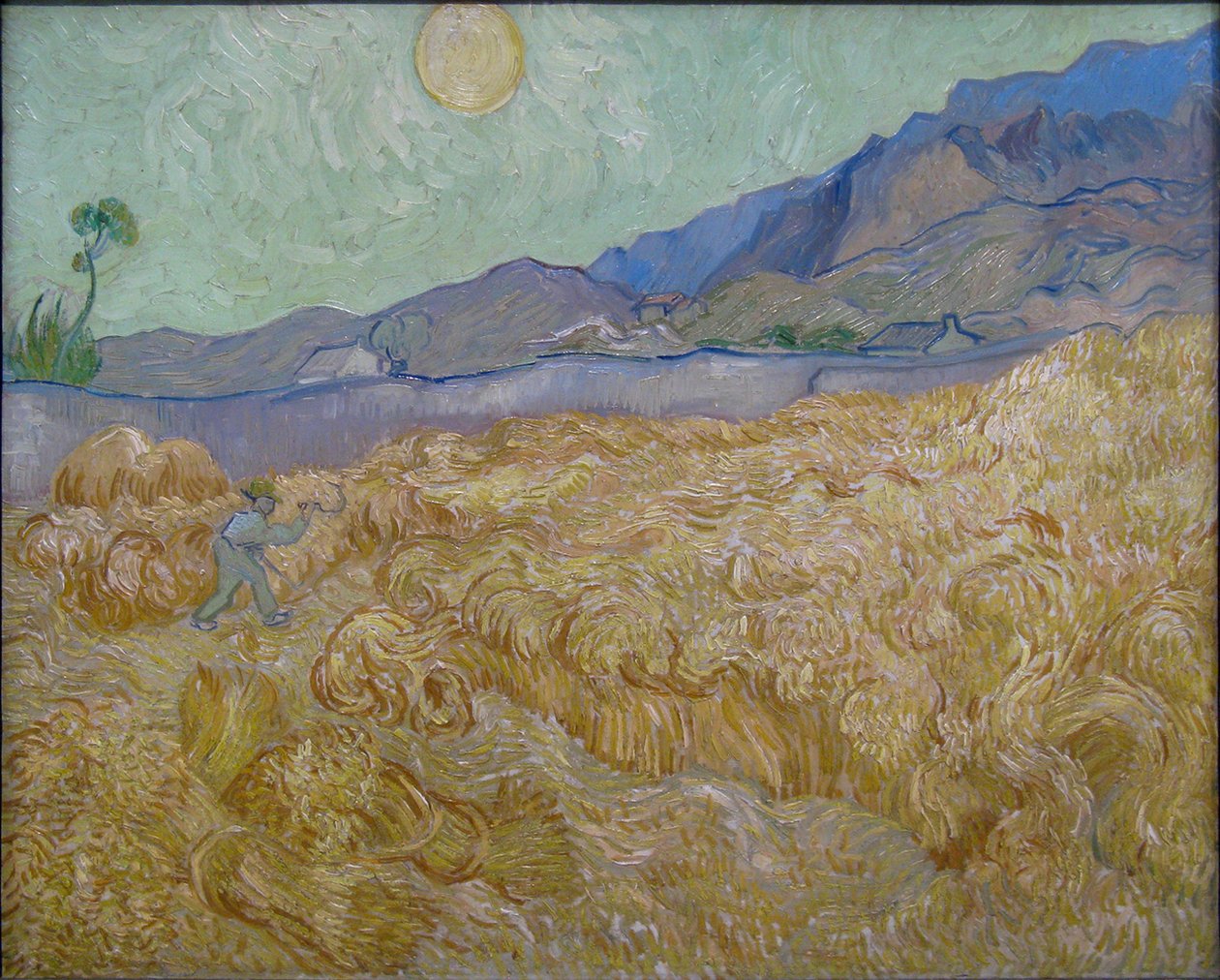 Champ de blé avec moissonneur - Vincent van Gogh